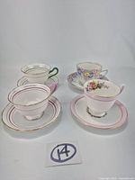 All four teacup and saucer sets in one frame