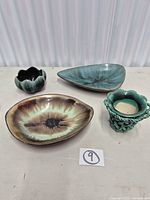 All four ceramic pieces on table