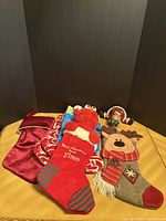 Group shot of four stockings and stocking holder