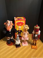 Full lot showing Rudolph figure, three nutcrackers and Rudolph box