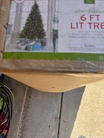Box label showing 6 ft lit Alberta spruce tree details