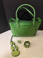 All items together: tote and three-piece jewellery set