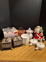 Group shot showing all items: three cookie jars, two decorative boxes, boxed candle warmer, candleholder, stackable bowls, soup bowls