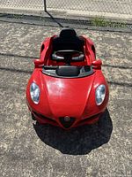 Front view of red Alfa Romeo ride-on car