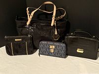 Four items shown; blue logo wallet excluded per seller; three black Michael Kors bags included