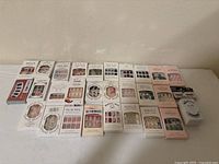 All boxed nail sets and eyelash pack laid out on table