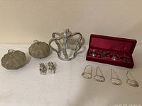 Full lot overview showing pumpkins, crown, angel ornaments in box, purse stands and decanter labels