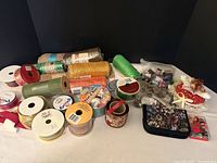 Full lot overview with ribbons, pouch, pin cushion, scissors, threads