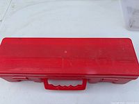 closed red plastic carry case