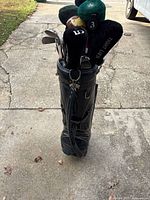 Full view of golf bag with clubs