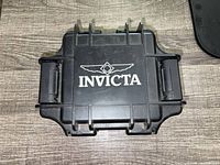 Closed black Invicta hard case