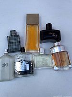 Group shot of all seven cologne bottles