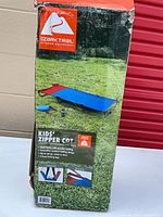 Front of retail box showing Ozark Trail Kids' Zipper Cot and product image