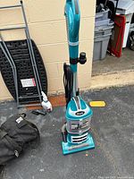 Full view of teal Shark Navigator Lift-Away upright vacuum