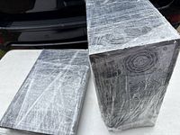 Tower and monitor wrapped in plastic on table