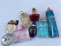 Group shot of all eight perfume and fragrance bottles