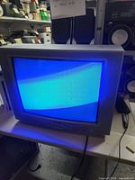 TV powered on showing blue screen