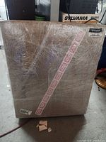 Shrink-wrapped bundle of flat corrugated boxes