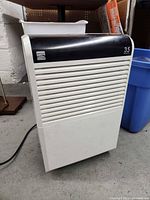 front view showing louvered grill, black control band and overall form