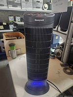 Full view of Honeywell tower heater standing on base