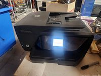 Front view showing touchscreen and output tray