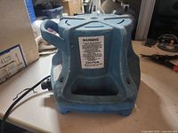 Rear view showing warning label and overall housing