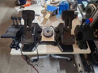 Full view of rudder pedals flanked by two throttle quadrants