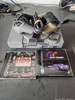 Console top view with controllers, memory card and two game cases