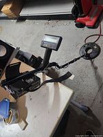 Full view of White's MXT metal detector showing control box, shaft and Eclipse 950 coil