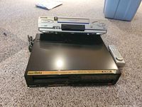 Front view of Sony Betamax SL-HF350 with Panasonic VHS player stacked on top and remote at side