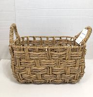 Front view of woven basket showing shape and weave pattern