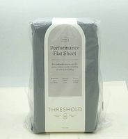 Front of packaged Threshold Performance king flat sheet