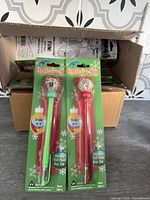 Two packaged pens showing design and colour variants