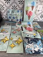 Group shot of all sealed party supply packages on countertop