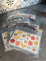 Stack of sealed Lunch Box Buddies sticker packs