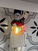 Nightlight plugged in showing red illumination