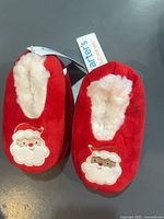 Top view of both pairs showing Santa motif and lining