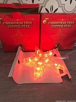 Both boxed toppers with one lit red