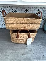 Both baskets stacked showing size difference and handles