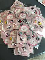 Pile of sealed 4-count shoe charm packs