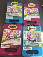 Four Peeps colouring kits, two blue two pink cases