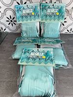 Five sealed Spritz garland backdrop packs displayed