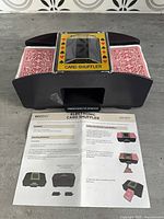 Front view of Vivitar automatic card shuffler with manual