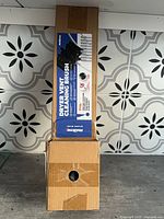 Front view of sealed Holikme dryer vent cleaning brush kit box showing product graphics and details