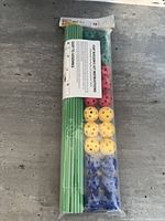 Front view of sealed fort building kit showing rods and connector balls