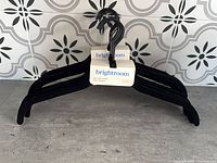 Two packs of Brightroom black velvet hangers stacked