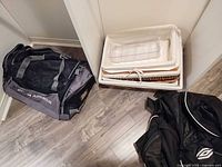 Group shot showing both duffle bags and stacked baskets/trays