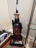Front view of Bissell PowerForce 6585C vacuum showing canister, foot controls and turbo brush