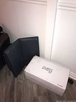 Box with iMRS One branding beside folded mat section