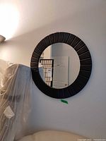 Full view of round mirror on wall